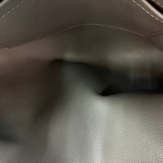 Bolsa Louis Vuitton Monogram Suede Whisper PM